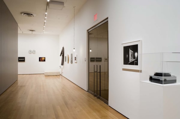 Installation view of Vik Muniz, Rebus at the Museum of Modern Art. Muniz chose to include Abelardo Morell's Lightbulb (1991) photograph, in the museum's permanent collection, in the exhibition. Photograph by Thomas Griesel.