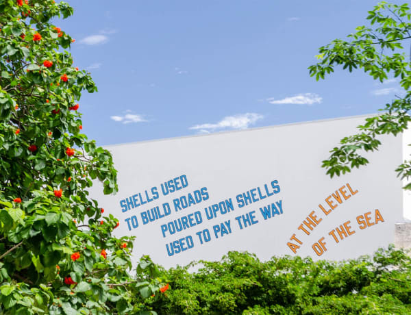 LAWRENCE WEINER: SHELLS USED TO BUILD ROADS POURED UPON SHELLS USED TO PAY THE WAY, AT THE LEVEL OF THE SEA (2008)