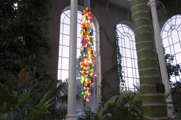 Candela 7/450 (For the Death Star) 2006 450 household bottles, low energy lamps, cable. Installed at the Victorian Palmhouse, Royal Botanic Gardens Edinburgh during the Edinburgh Art Festival in August 2006. image courtesy Ruth Clark