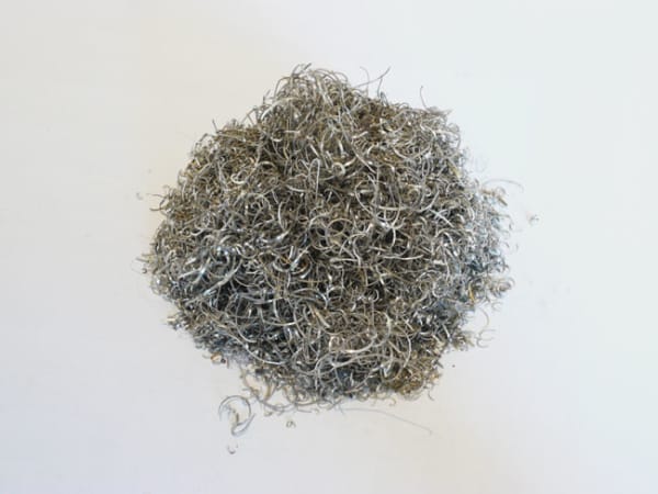 The Negative of Words 1996 Silver residue accumulated form a silversmith engraving words by hand 10.5 x 10.5 x 7.8 cm | Collection of the Artist