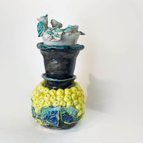 Vase with yellow beads