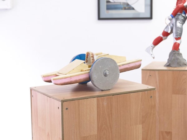 Katrin Plavcak, "Joyride (On the water. On the land." (2012), concrete wheels, wood, dentures, styrofoam, 37x40x20cm