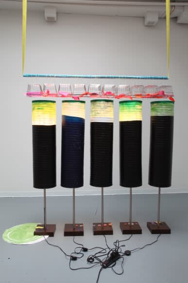 Jessica Stockholder, Informal Get Together [JS 623], 2014. Aluminum tube, yellow webbing, pink plastic and fabric parts, baskets, 5 Ikea lamps, small rug, power bar and acrylic paint, 96 x 85 x 24 in. Height variable