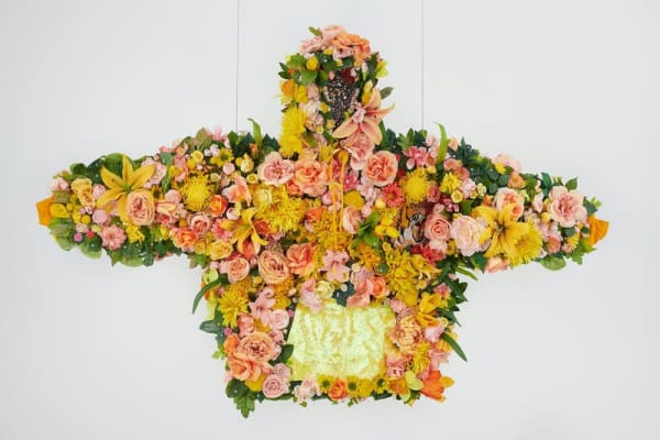 Devan Shimoyama, February II, 2019. Silk flowers, rhinestones, jewelry, sequins, and embroidered patch on cotton hoodie with steel armature, coated wire and fishing line, 45 x 72 x 12 in. Courtesy of Private Collection and De Buck Gallery, New York. Photo: Phoebe dHeurle.