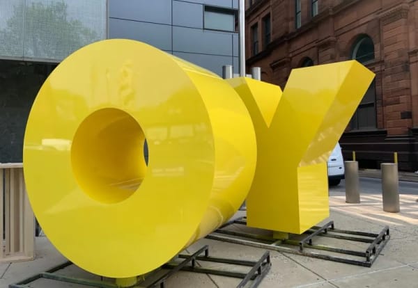 The new sculpture outside the Weitzman National Museum of American Jewish History isn't just a two-letter message — it's two words, depending on what side you view it from. Photo courtesy of John McDevitt & KYW Newsradio.