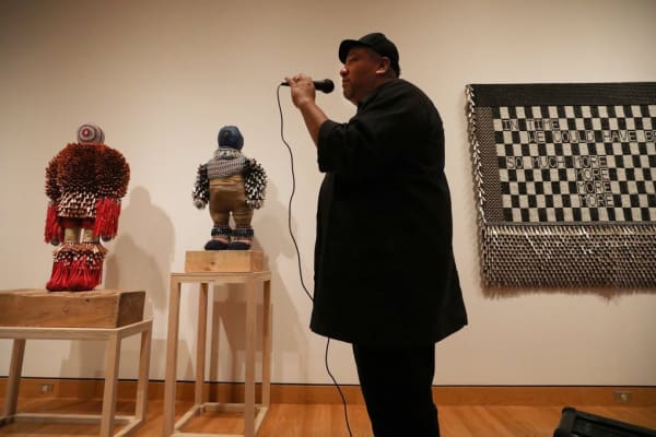 Artist Jeffrey Gibson leads a tour through his exhibition, “Like a Hammer,” currently on view at Seattle Art Museum. (Alan Berner / The Seattle Times)