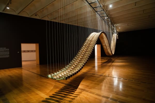 A serpentine sculpture, "Bridge," is part of an exhibit on social justice at the High Museum of Art.Credit...Kevin D. Liles for The New York Times