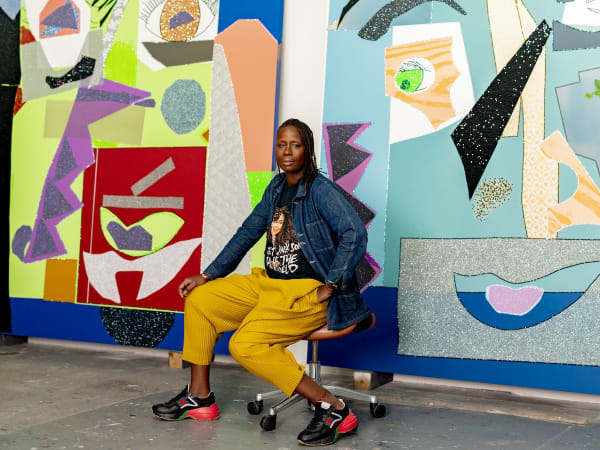 Artist Mickalene Thomas sits in her studio in Brooklyn. Mickalene Thomas: Avec Monet is her first exhibition at a museum in France. (Elias Williams for The Washington Post)