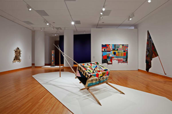 Jeffrey Gibson's SAM exhibition, "Like A Hammer," incorporates his Native American roots with contemporary influences as seen in his work of art.