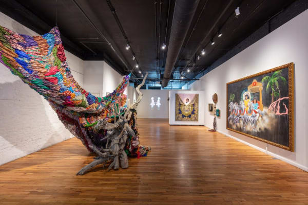 Suchitra Mattai works with found and collected objects, such as the hundreds of vintage saris used in the piece, “Breathing Room,” which also incorporate driftwood and table legs. (Photo by Wes Magyar, provided by K Contemporary)