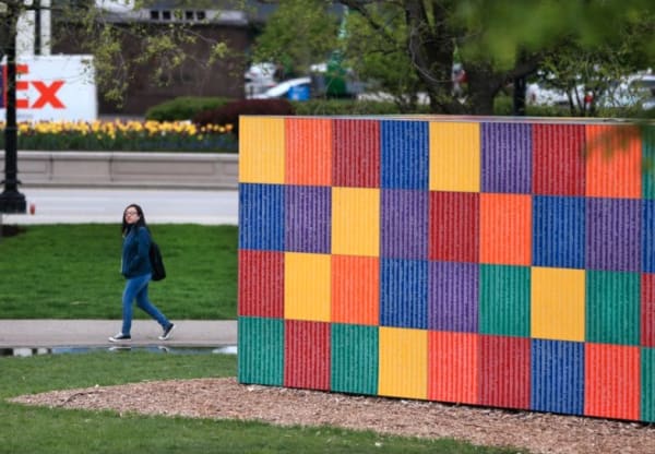 A person walks past Tony Tasset's Artists Monument in Chicago's Grant Park on Wednesday, May 4, 2016. (Chris Sweda / Chicago Tribune