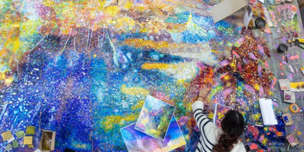 Artist Firelei Báez works on a 30-foot-long site-specific mosaic commissioned by Buffalo AKG and installed in the Knox Building. PHOTO COURTESY THE BUFFALO AKG ART MUSEUM.