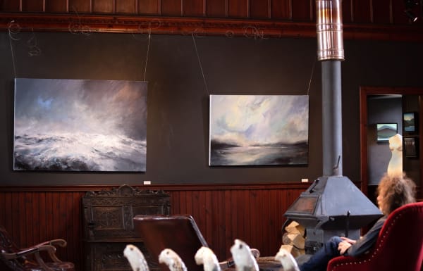 Looking towards two Janette Kerr sea paintings. May 2023