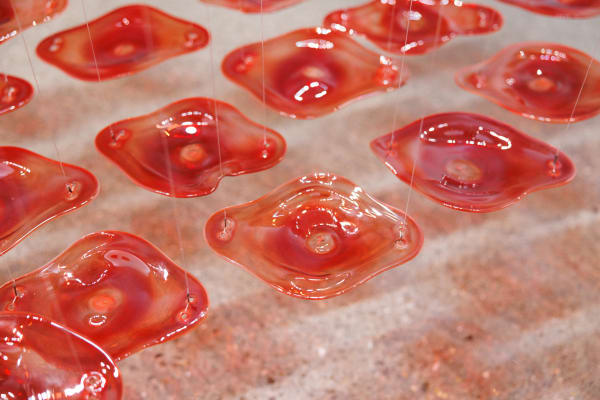 Dima Srouji, The Red River (Detail), 2023, Installation, Hand-blown glass, 150 x 550 cm, Commissioned by Tai Kwun Contemporary, Courtesy the artist and Lawrie Shabibi