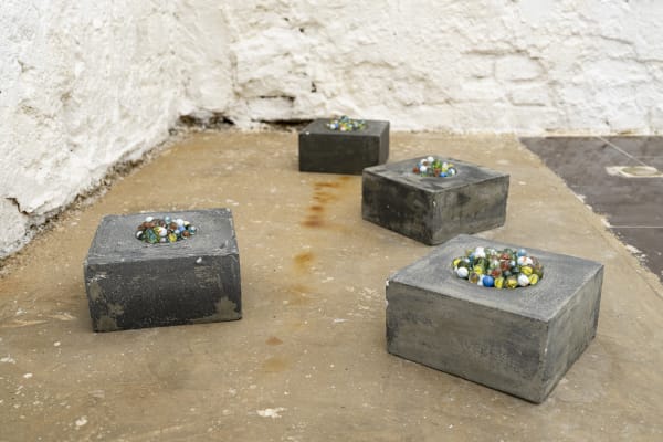 DELUDE YOURSELF, LET NOTHING DISTURB YOU 2025 Concrete and glass marbles 25 x 25 x 12 cm each (Set of 4 pieces)