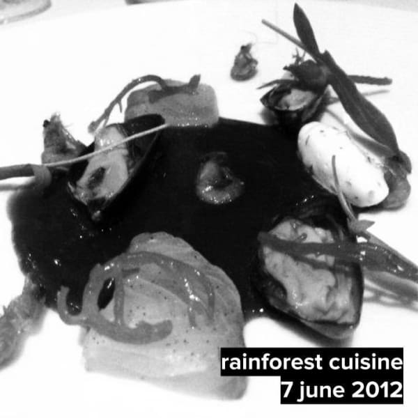 Hay Smoked Seafood with Buah Asam Kecelak caviar and Bitter Daun Sing Kong coulis.