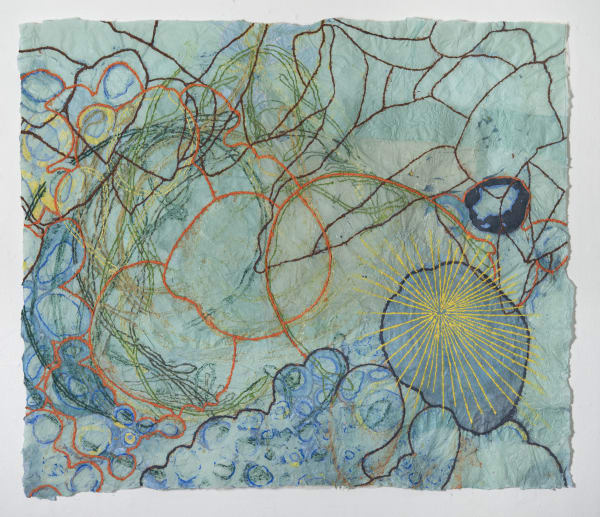 Nancy Cohen's "Dissoulution" done with paper pulp and handmade paper in various shades of green, blue, orange, yellow and brown. The piece depicts several design layers on the light aqua paper. These designs are overlapping each other creating depth.