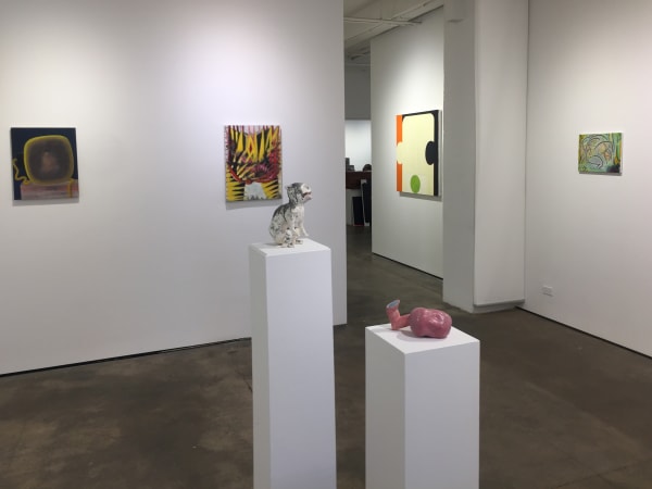 Gallery photograph of an installation featuring two sculptures and four abstract paintings on canvases.