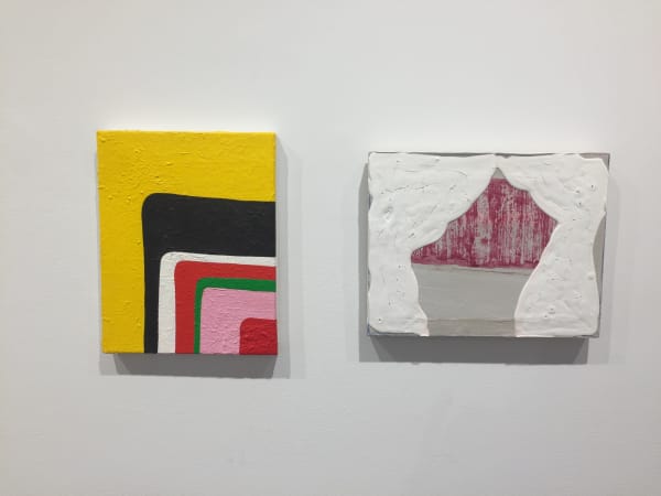 Gallery photograph of an installation featuring two abstract paintings in shades of yellow, black, white, red, green, pink and gray respectively.