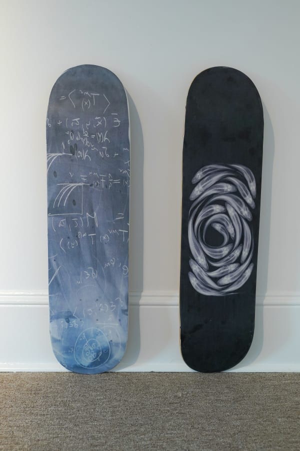 Picture on paintings on two boards, one black and white and one foggy blue themed