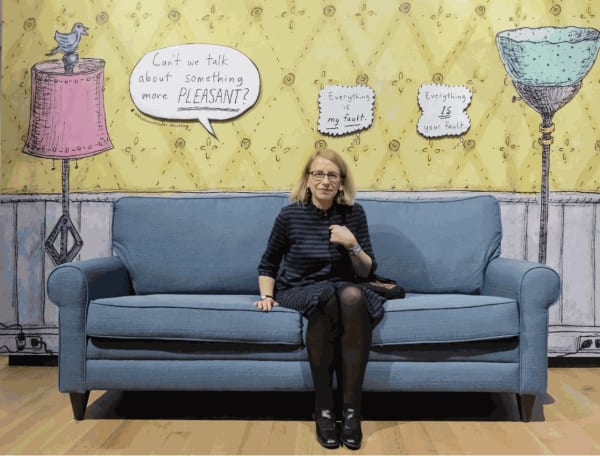 Roz Chast sitting on couch.