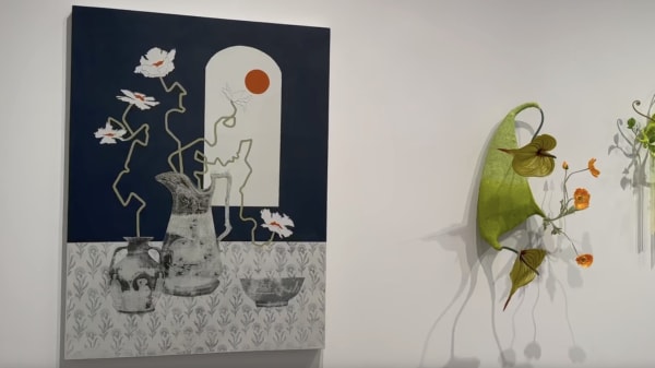 Black, white, red, gray painting of flowers in vases and wall sculpture of fake flowers on gallery wall.