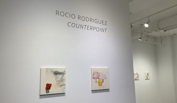 Two abstract paintings on gallery wall by Rocio Rodriguez