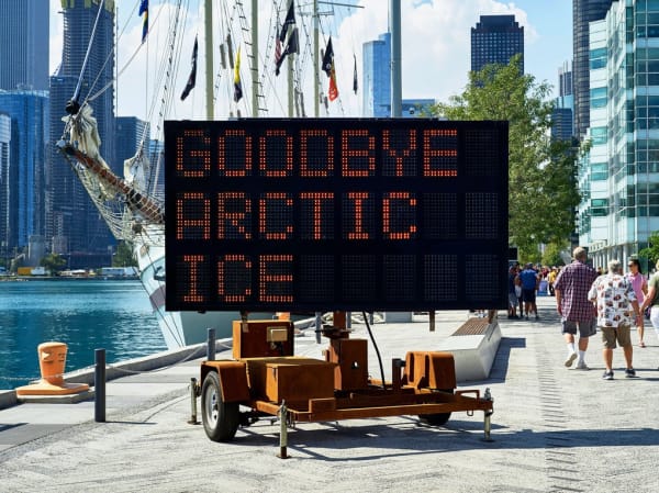 Justin Brice Guariglia, WE ARE THE ASTEROID II, 2018. Solar-powered LED highway message sign, sand-blasted with rusted patina. Text: Timothy...