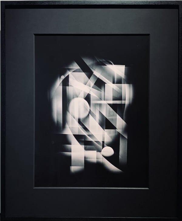Michael G Jackson, representation of Central Park in New York City with abstract visual of Luminogram silver gelatin print in very unique way, like neon lights in the night, this is a uniqe fine art print, hand made in the darkroom, Framed with black moun