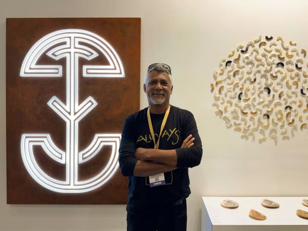 Darrell Sibosado in front of his works at India Art Fair. New Dehli. 2025