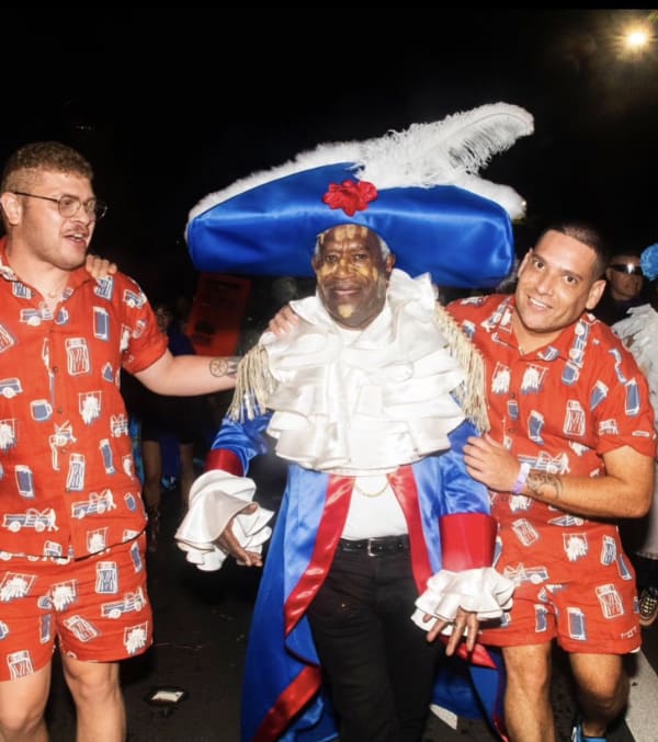 Robert Cole with Dylan Mooney's portrait of Robert's brother, Malcom Cole. Photo by William Yang.