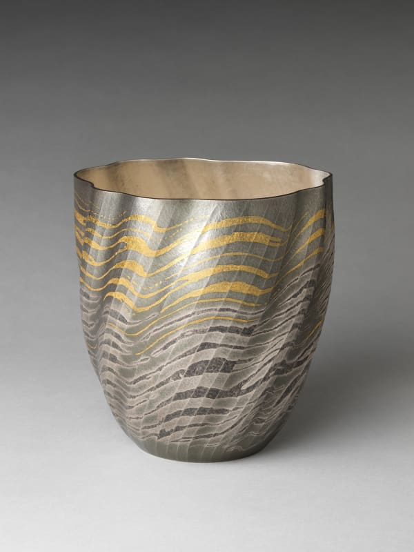 Osumi Yukie (Japanese, born 1945). High Tide Comes In (Shiomitsu), 2007. Heisei period (1989–2019). Hammered silver with nunomezōgan (textile imprint inlay) in lead and gold. H. 9 1/2 in. (24.1 cm); Diam. 9 in. (22.9 cm). The Metropolitan Museum of Art, Gift of Hayashi Kaoru, in celebration of the Museum’s 150th Anniversary, 2020 (2020.76.1)