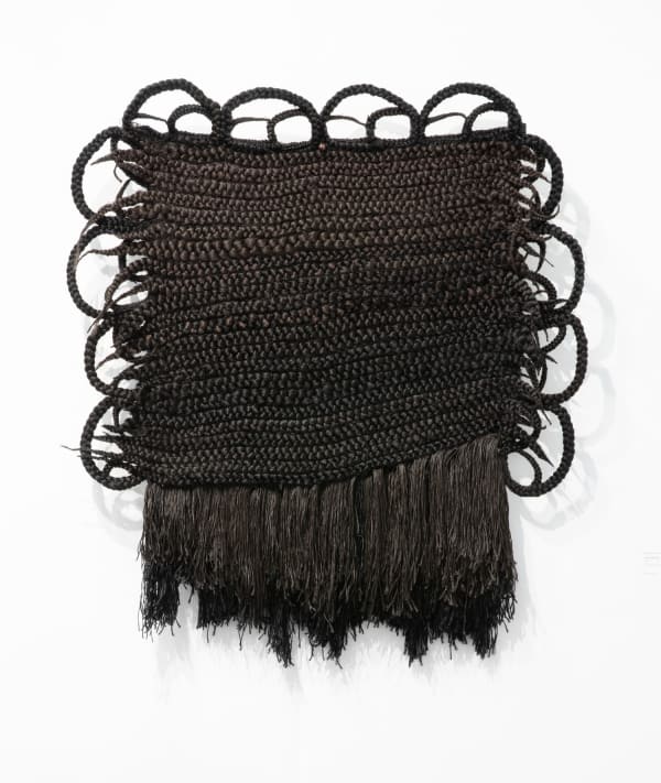 Joanne Petit-Frère, "Tapestry of Braids #1 (Woven while Discovering bell hooks on YouTube)," (2020). Synthetic hair, thread, wire, 54 x...
