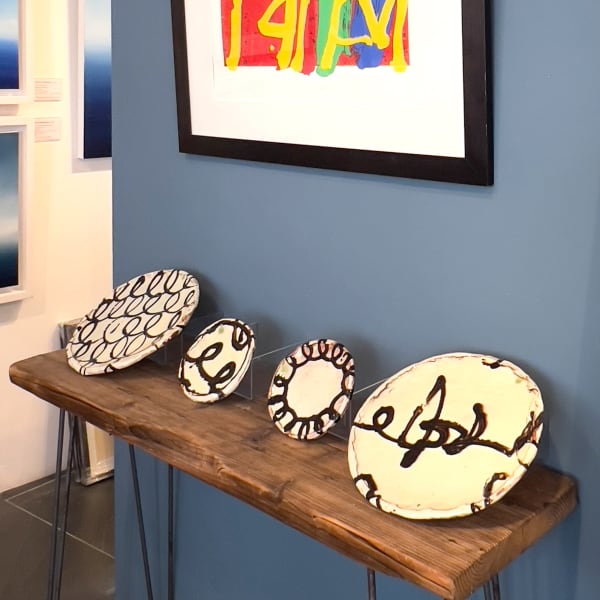 Display of four 'Plates' by Dylan Bowen, complemented with silkscreen with woodblock print 'Concordia I' by Albert Irvin.