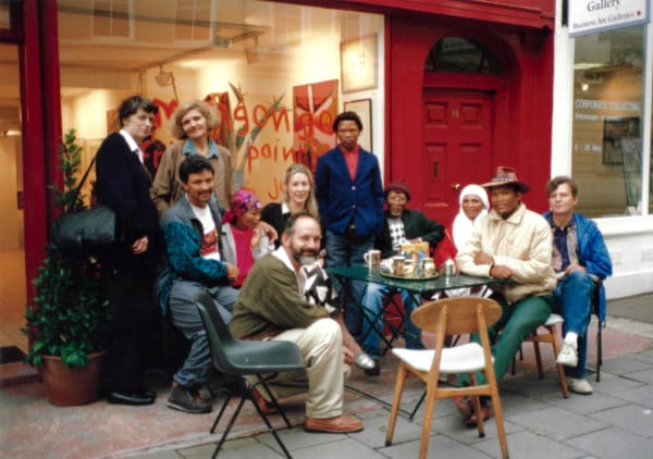 Rebecca Hossack with the African Bushmen artists during their first exhibition in London at the Rebecca Hossack Art Gallery in 1993.
