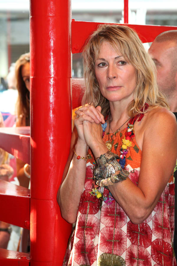 Rebecca Hossack posing at the Rebecca Hossack Art Gallery in Conway Street