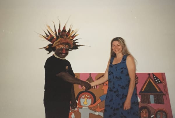 Rebecca Hossack and Mathias Kauage in front of his painting acquired by the National Art Fund for the Cambridge Museum