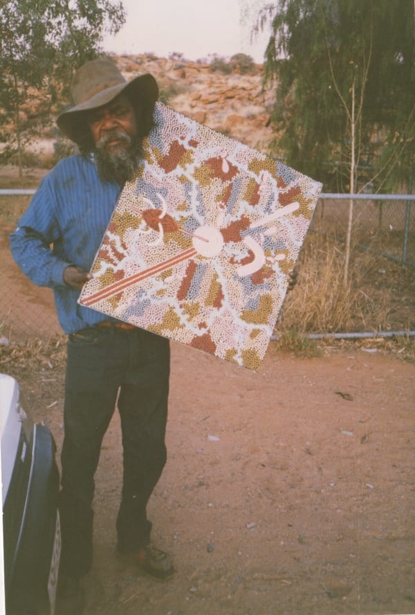 Clifford Possum and his painting for the gallery