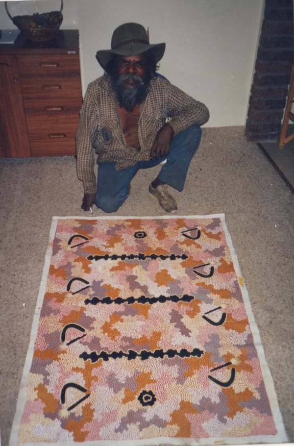 Clifford Possum and his painting for the gallery