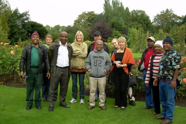 Rebecca Hossack with artists from Hailans To Aylans Exhibition