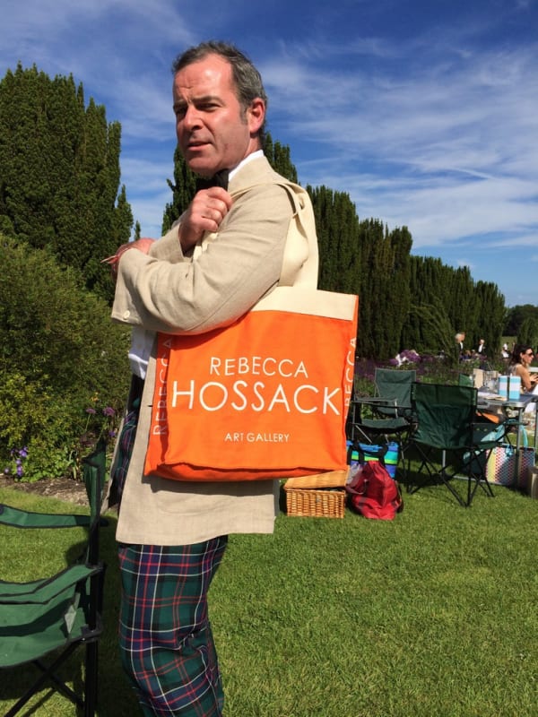 John Seagrim with Rebecca Hossack Art gallery bag at Glyndebourne