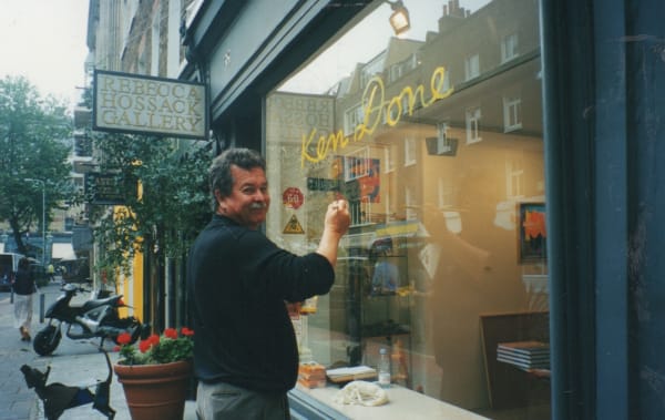 Ken Done decorating Rebecca Hossack Art Gallery's window for his exhibition