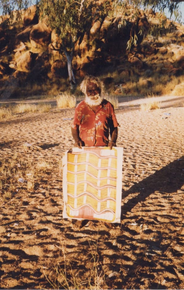 Aboriginal artist Billy Stockman Tjapaltjarri in the Australian desert