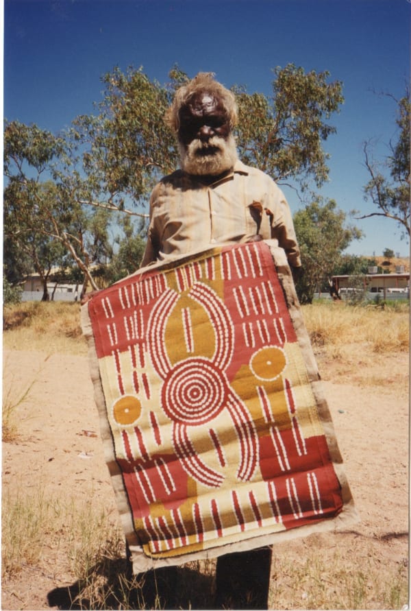 Aboriginal artist Billy Stockman Tjapaltjarri in the Australian desert during one of Rebecca Hossack's visits