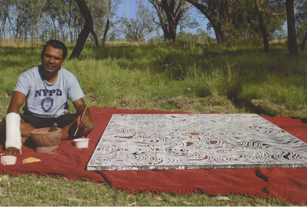 Lloyd Kwilla painting in Kununurra, Western Australia