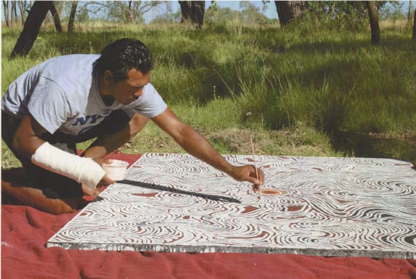 Lloyd Kwilla painting in Kununurra, Western Australia
