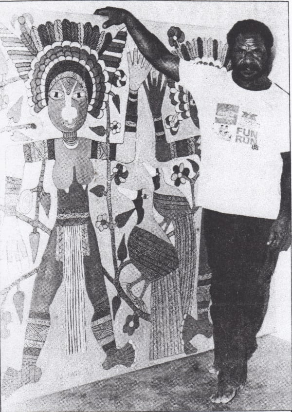 Mathias Kauage with one of his paintings