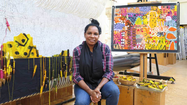 Naomi Hobson in front of her design for 'The Royal Harvest' tapestry at the ATW in 2021.