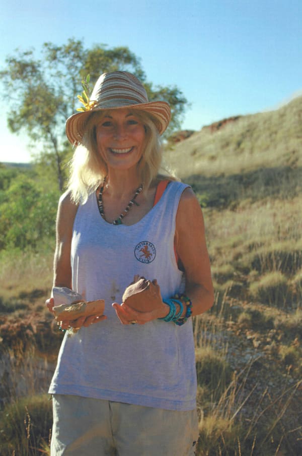 Rebecca Hossack in the Kimberleys with ochres used in Lloyd Kwilla's paintings