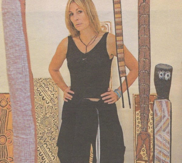 Rebecca Hossack surrounded by aboriginal artworks